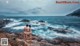 A man and a woman standing on a rocky beach.